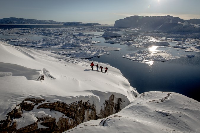 Snowshoeing near Sermermiut on the edge of the Ilulissat ice fjord in Greenland
